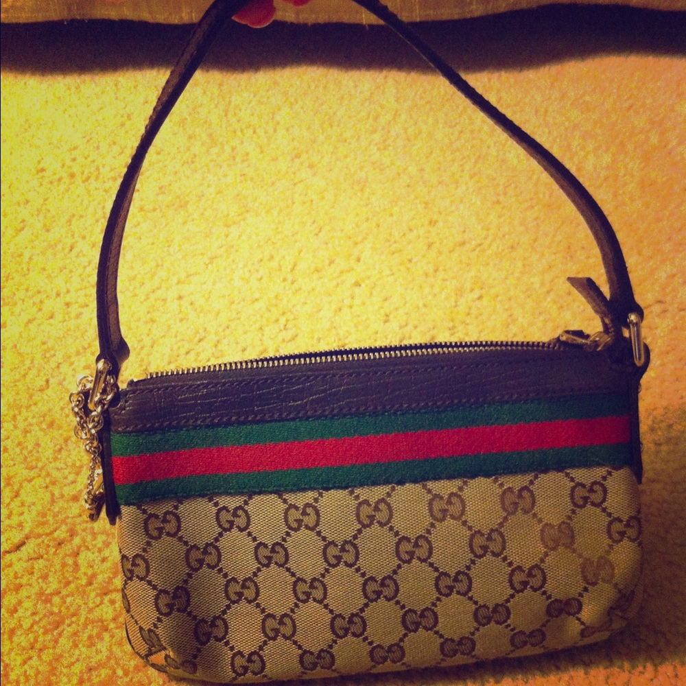 Authentic Gucci purse with gold accents