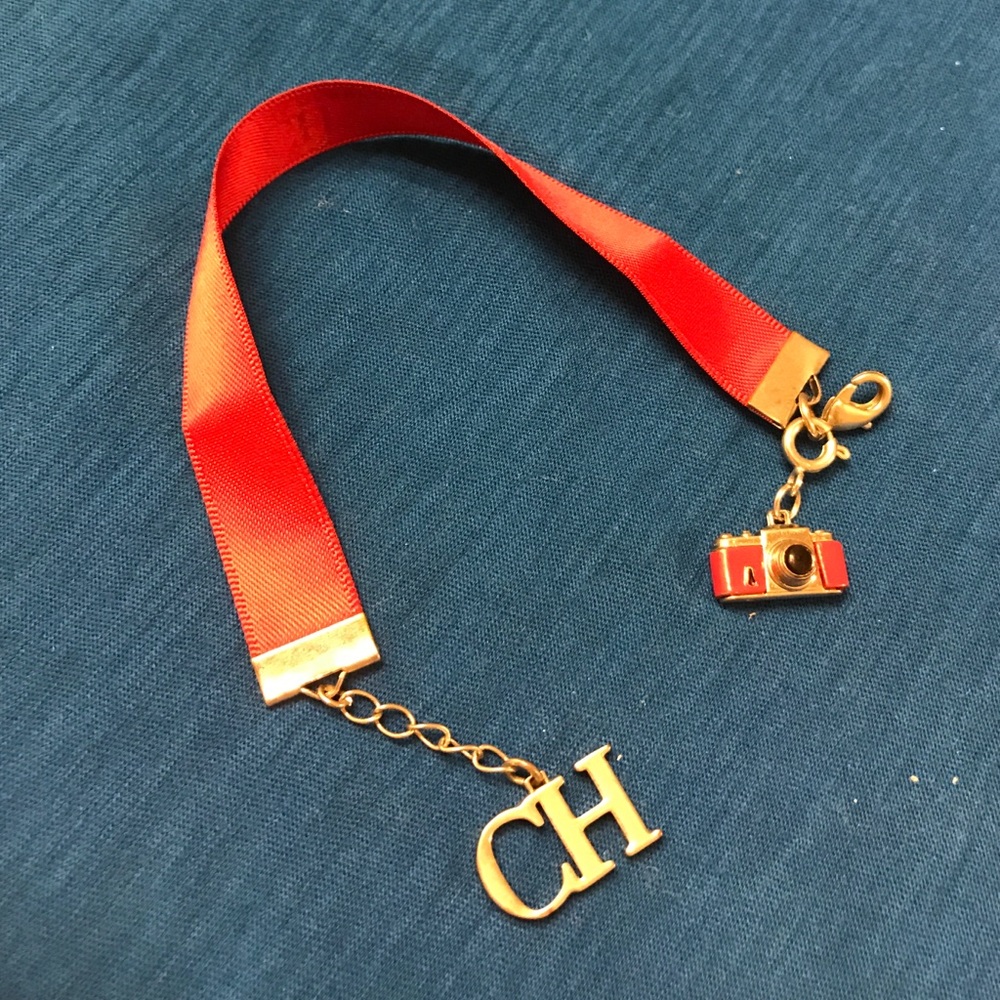 Original Carolina Herrera red bracelet.