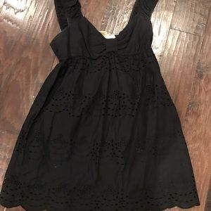 Cute cut out black dress. Mid thigh leg. LARGE.