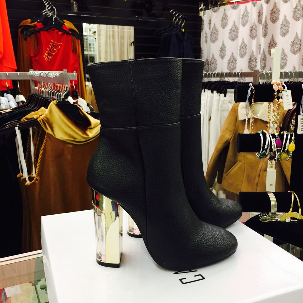 Black boots with gold and clear heels