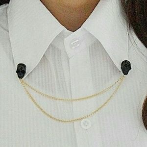 Black skull on golden chain collar brooch