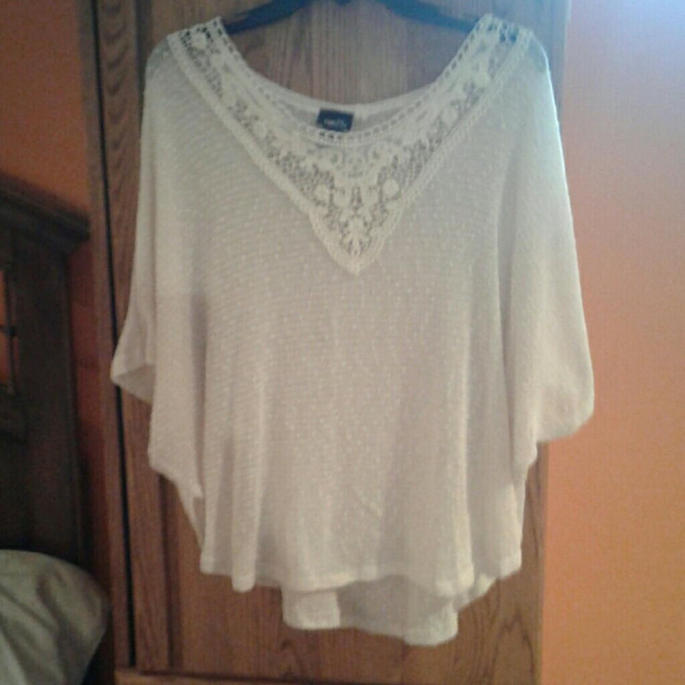 Cream colored poncho with sleeves