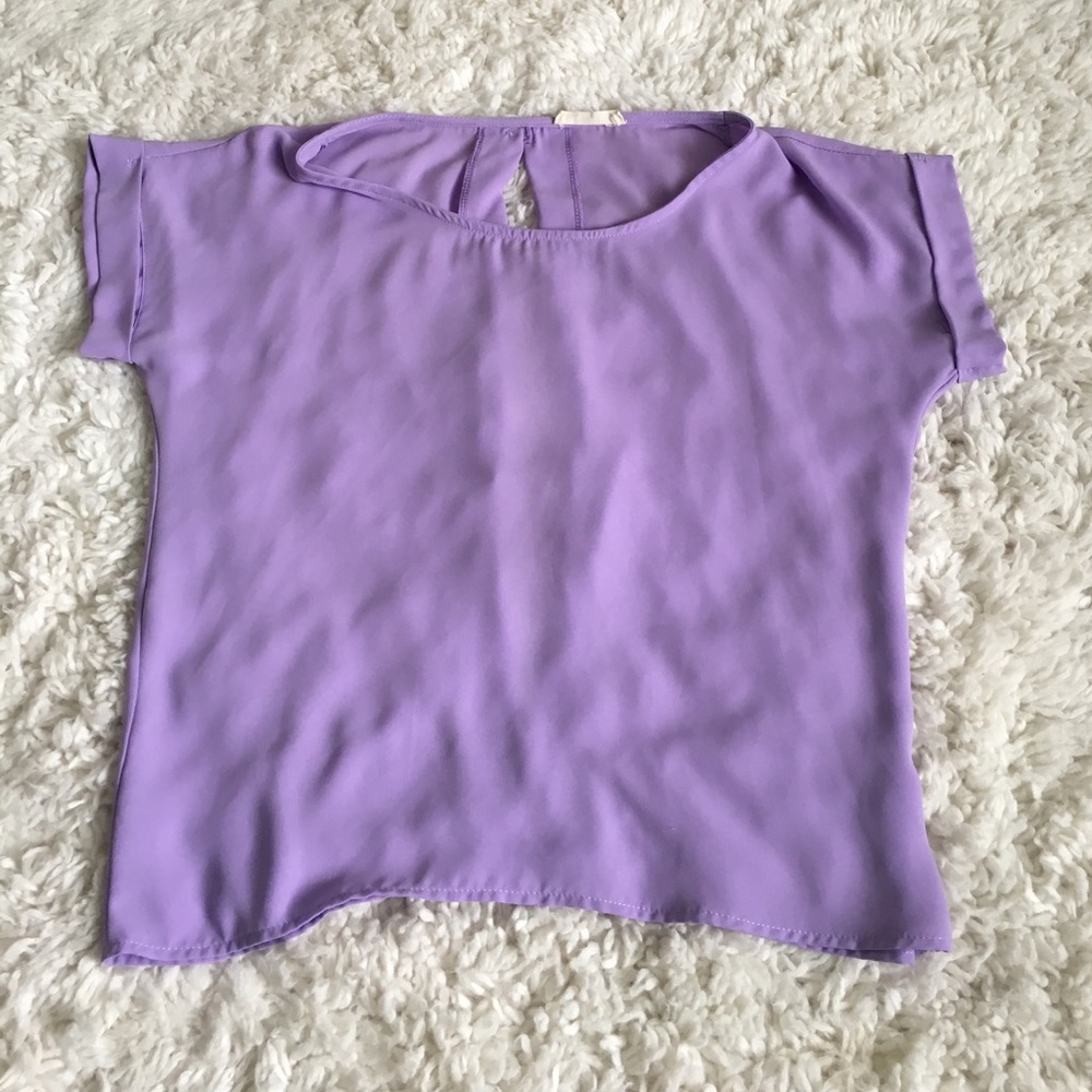 Lavender blouse with gold buttons