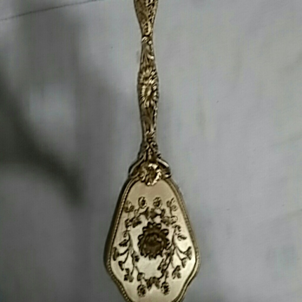 Vintage golden metal hairbrush