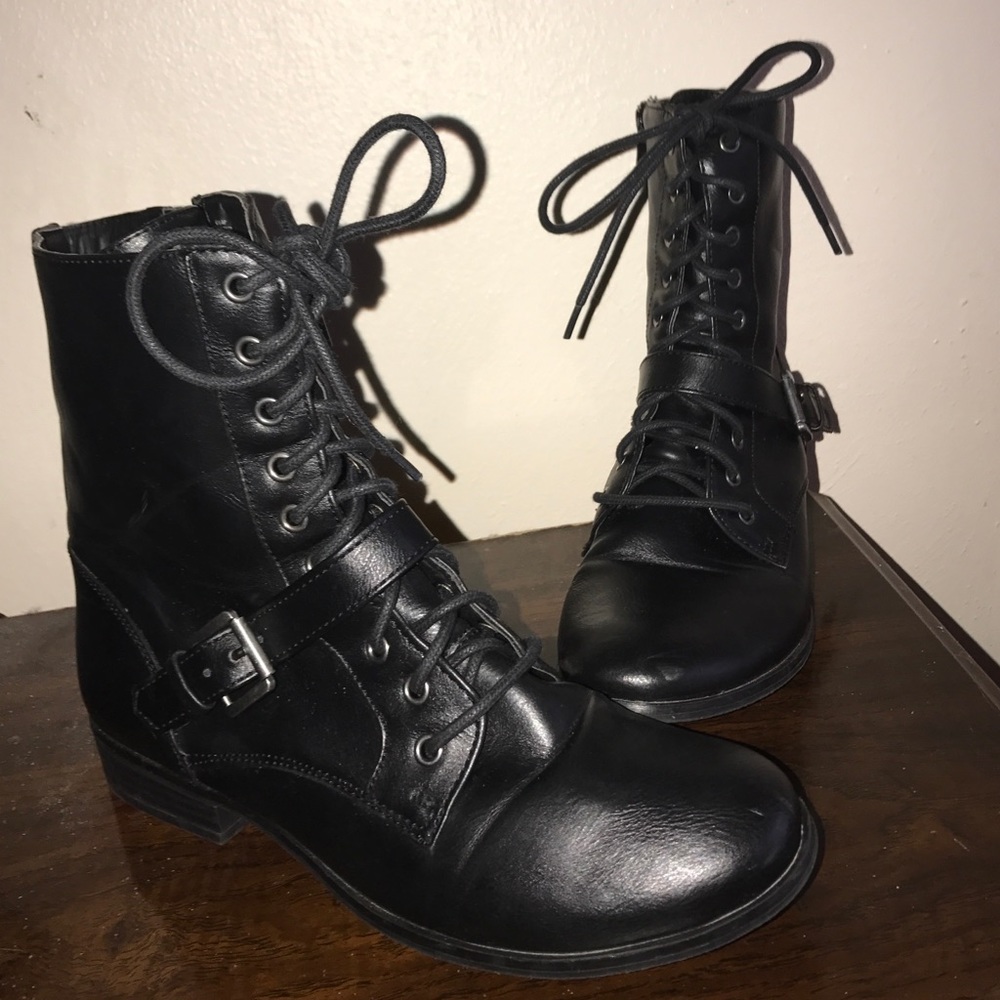 Black combat boots .