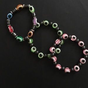 3 Evil Eye bracelets.