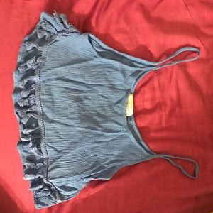 Light blue cropped tank with detail.