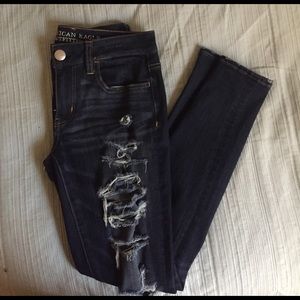 dark blue ripped jeans