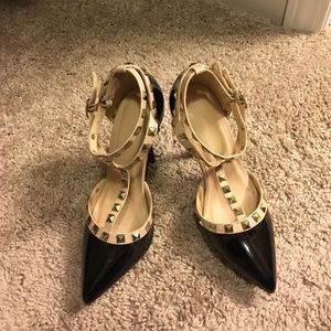 Tan and black heels with gold accents