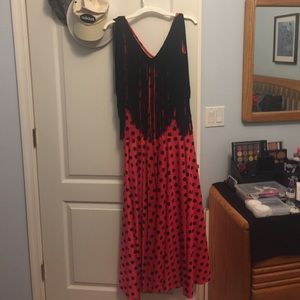 Sevillana dress and sleeveless dress with fringe