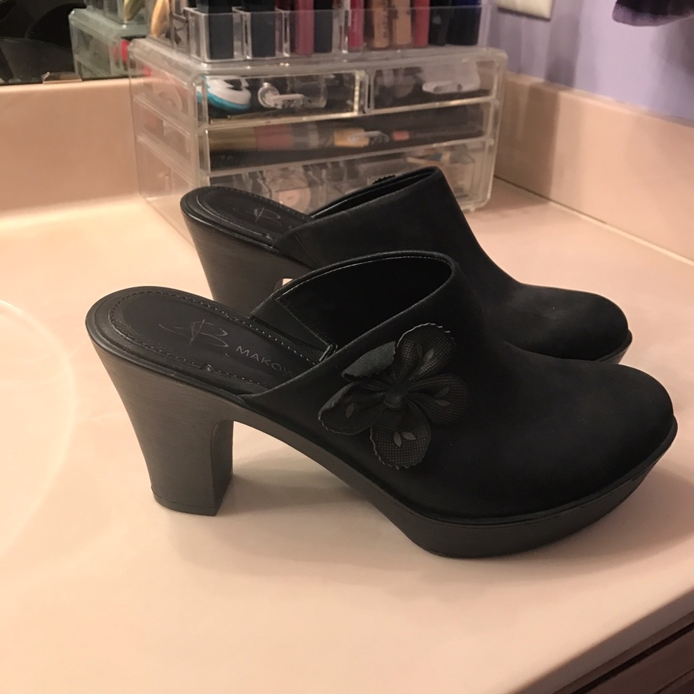 All leather Bob Makowsky flower clogs.