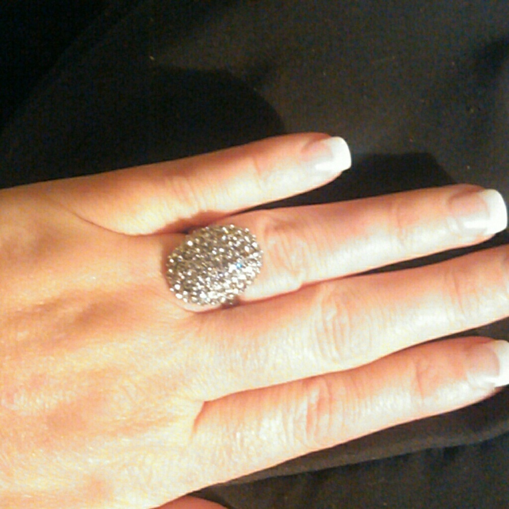 Silver rhinestone ring.