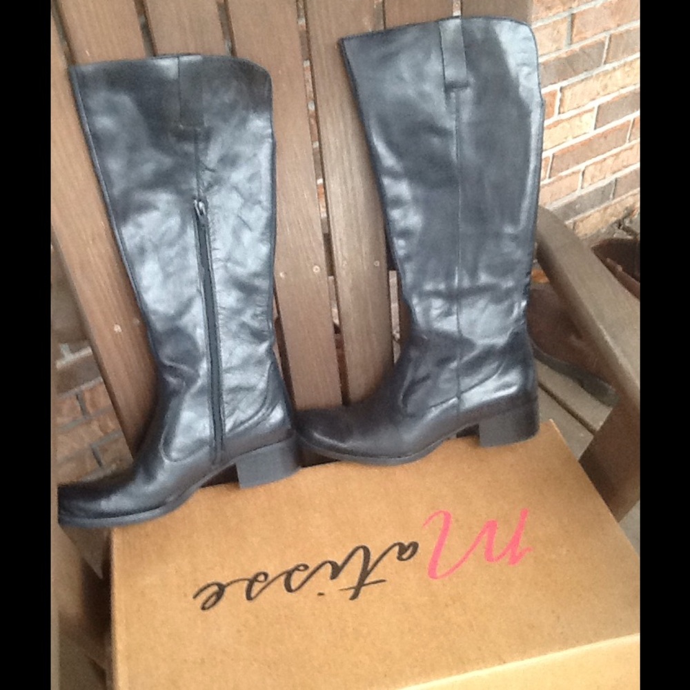Born tall black boots