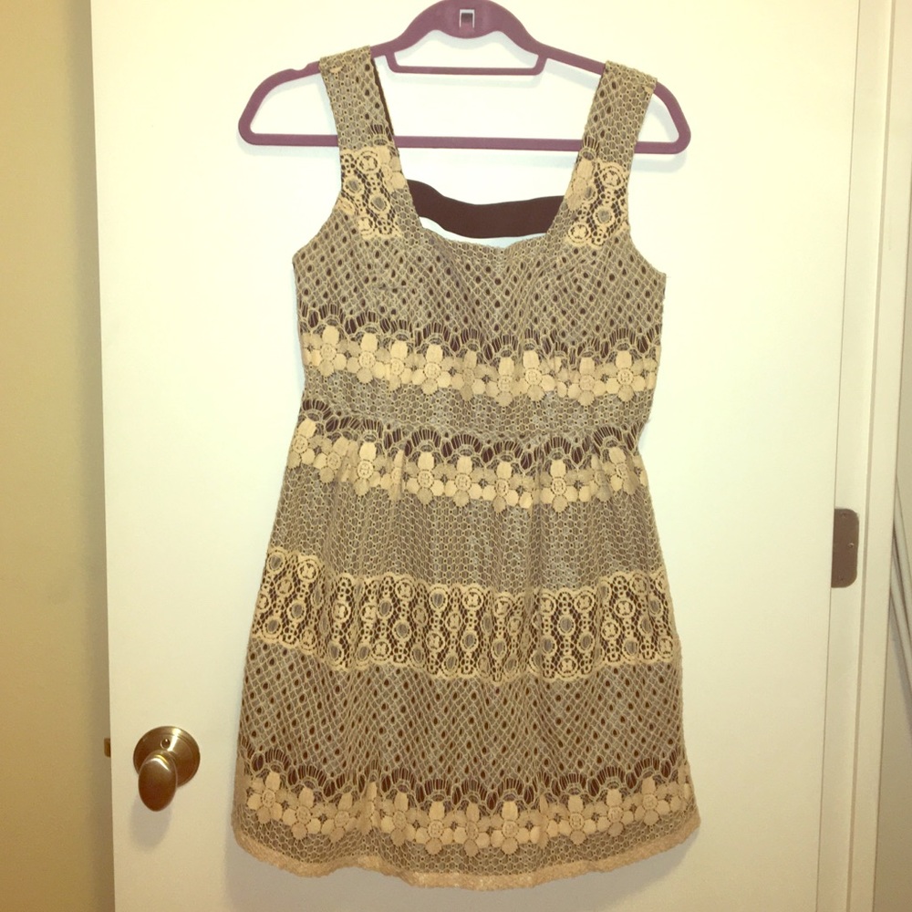 Fit and flare creme dress w/ cut out back!