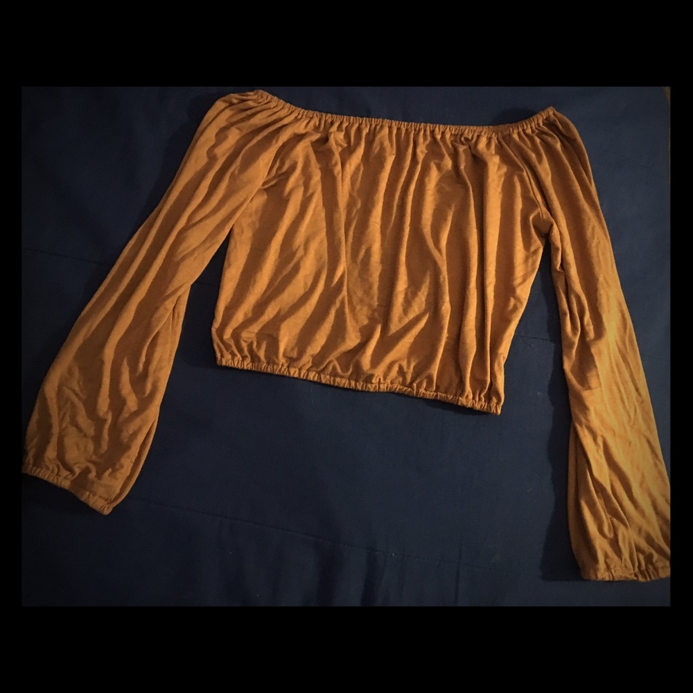 A dark mustard color crop top