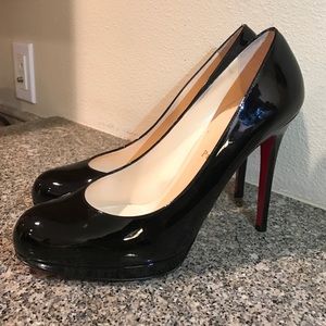 Christian Louboutin black pumps