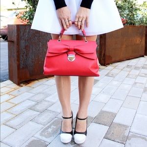 Red handbag with bow detail