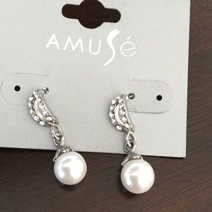 Cubic zirconia and pearl hanging earrings.