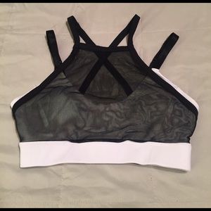 White sports bra with black mesh overlay