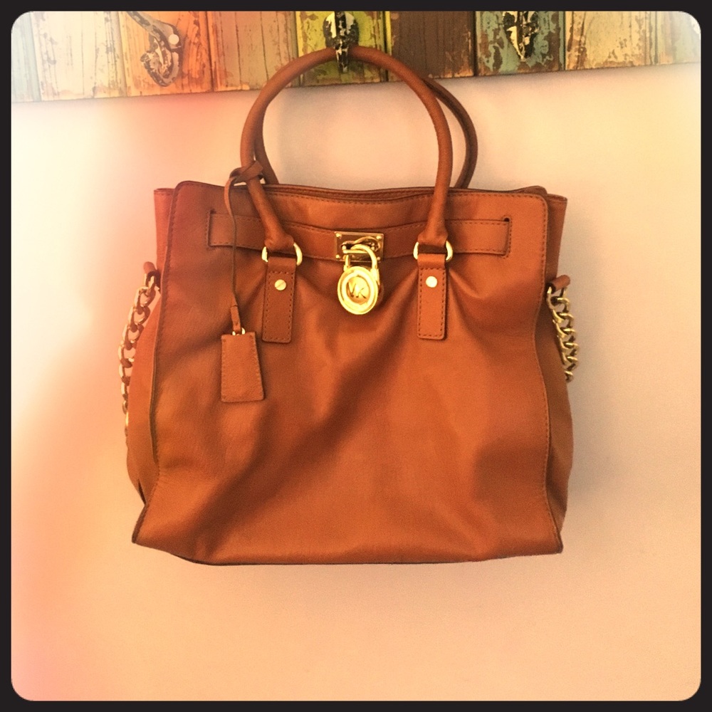 Used Michael Kors large Hamilton purse in luggage