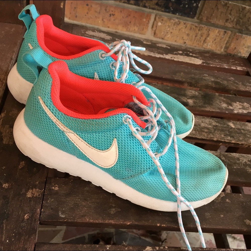Teal and pink Nike Roshe running shoes