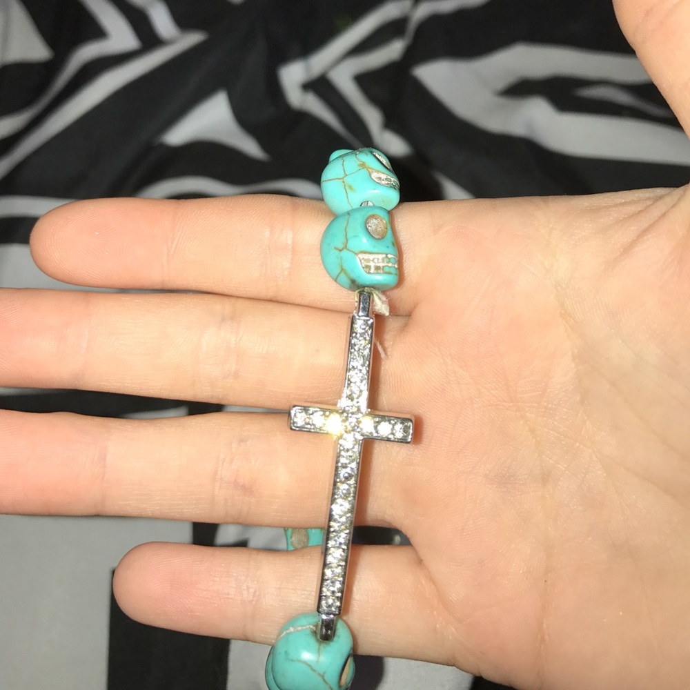 Cross bracelet with skulls