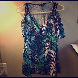 Snake skin top with peek-a-boo sleeves.