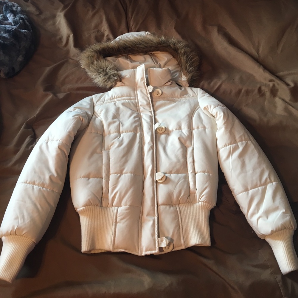 Beige puffer jacket with fur hood