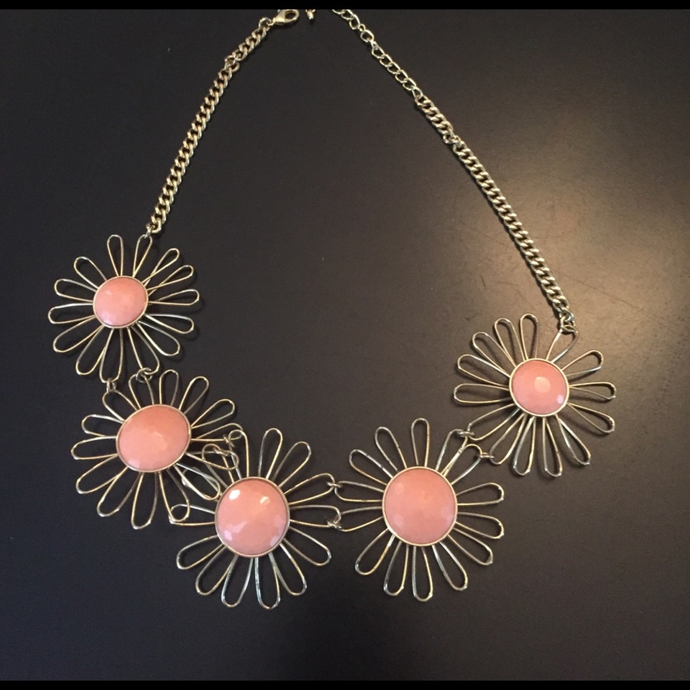 Adorable gold flower necklace with peach detail!