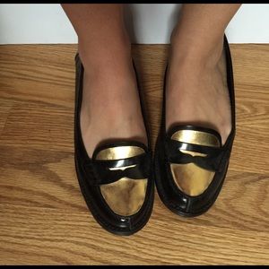 Black and gold penny loafers