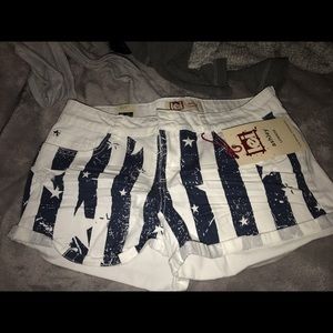 NEVER WORN WHITE AND BLUE FLAG SHORTS