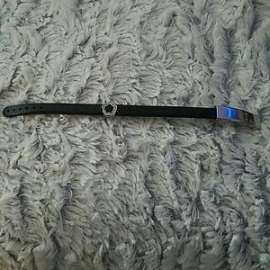 Black band bracelet with flower charm