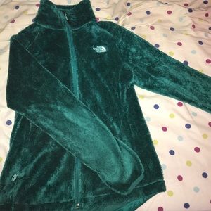 Green North Face zip up jacket