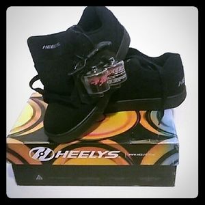 Heelys men's size 9 brand new, never worn, in box.