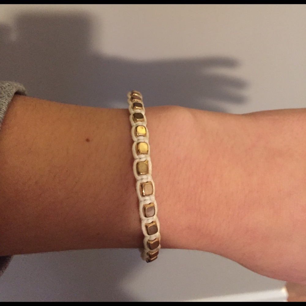 Tan and gold bracelet