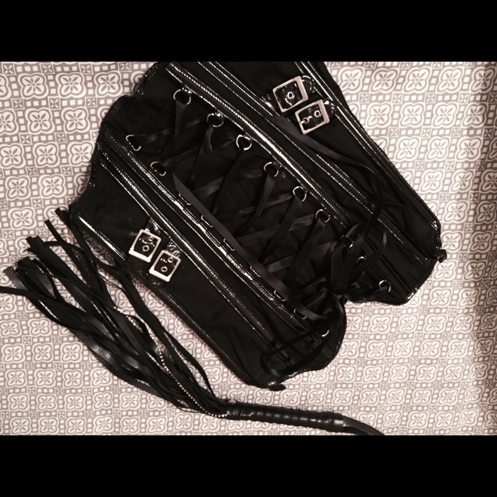 Black leather corset & whip