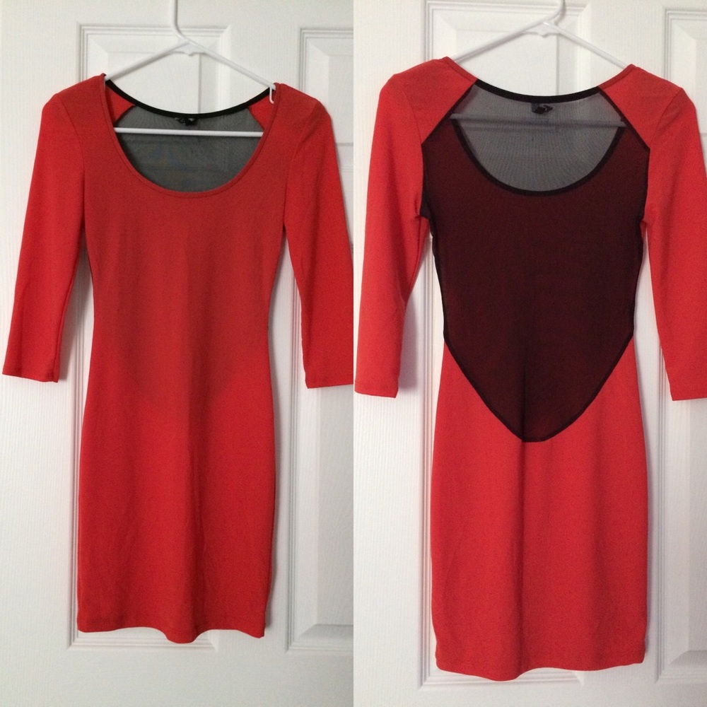 Orange long sleeve backless dress.
