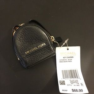 Super adorable MK black backpack key chain.
