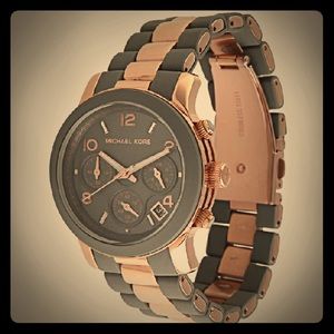 MK 5465 runway gray and rose gold silicone watch.