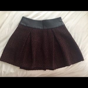 Maroon & black tweed skirt with leather band. BCBG