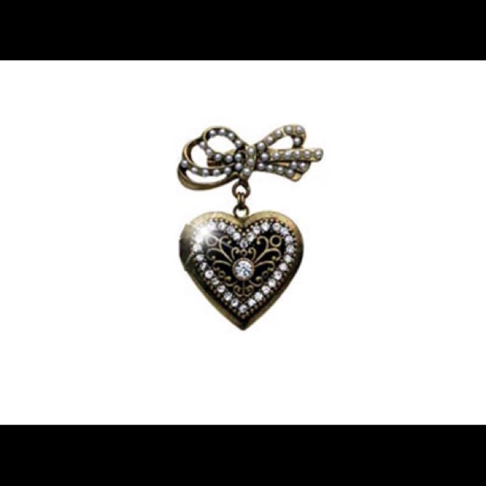 Unique heart burnished Goldtone heart locket.
