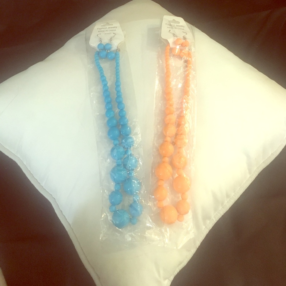Two necklace and earring sets