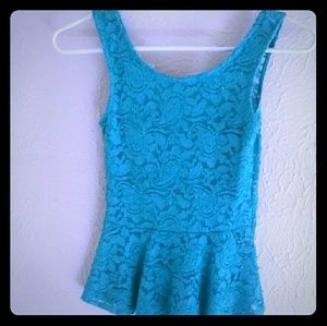 Cute turquoise peplum top, ribbon on back