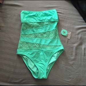 One piece with mesh cutouts