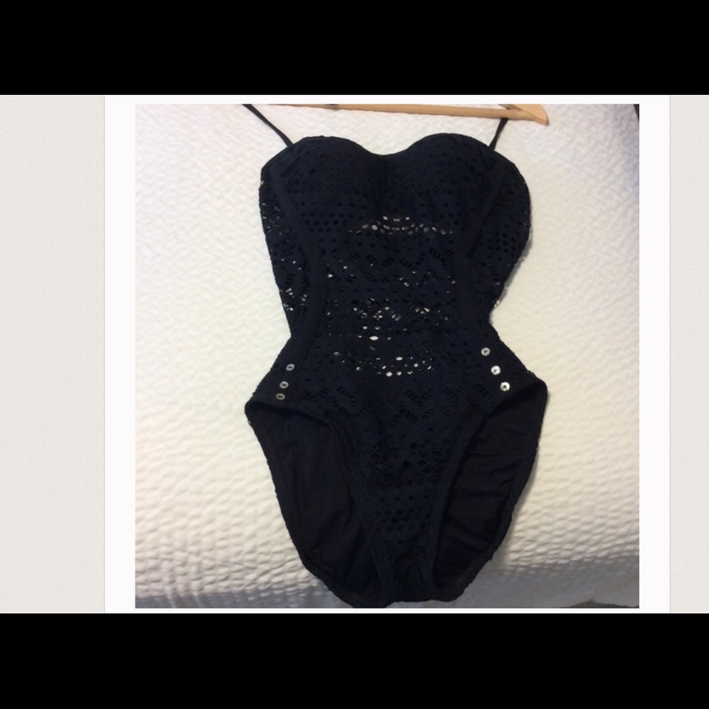 Swimsuit With sheer lace that flatters any shape.