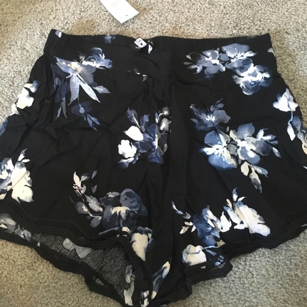 Black shorts with blue and white flowers