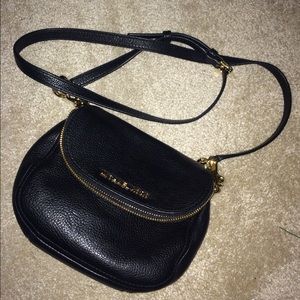 Michael Khors crossbody black purse.