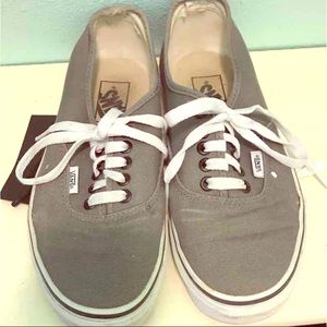 Gray, white, and black Vans