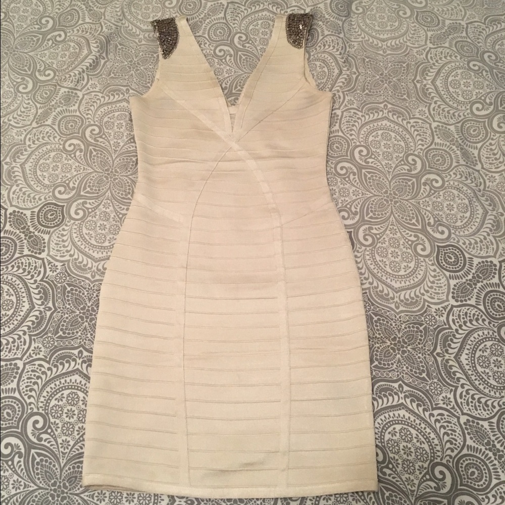 Cream with metal detail, body con dress.