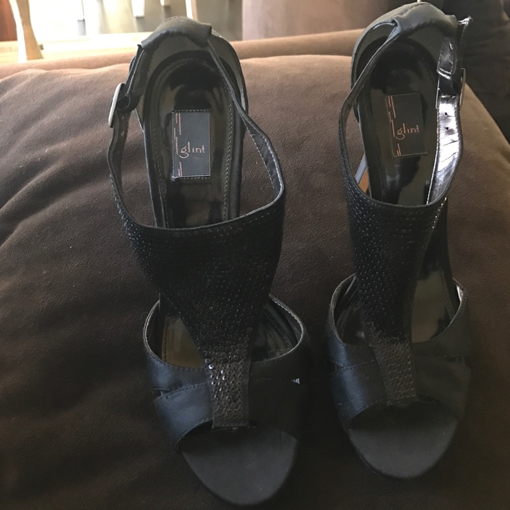 Black strappy heels with t-strap embellishment